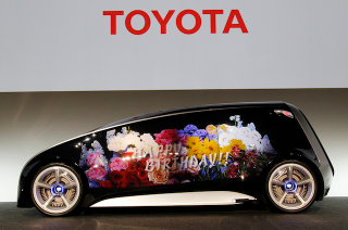 Illustration for article titled Toyota's Insane Concept Car Has Giant Touch-Screen Doors